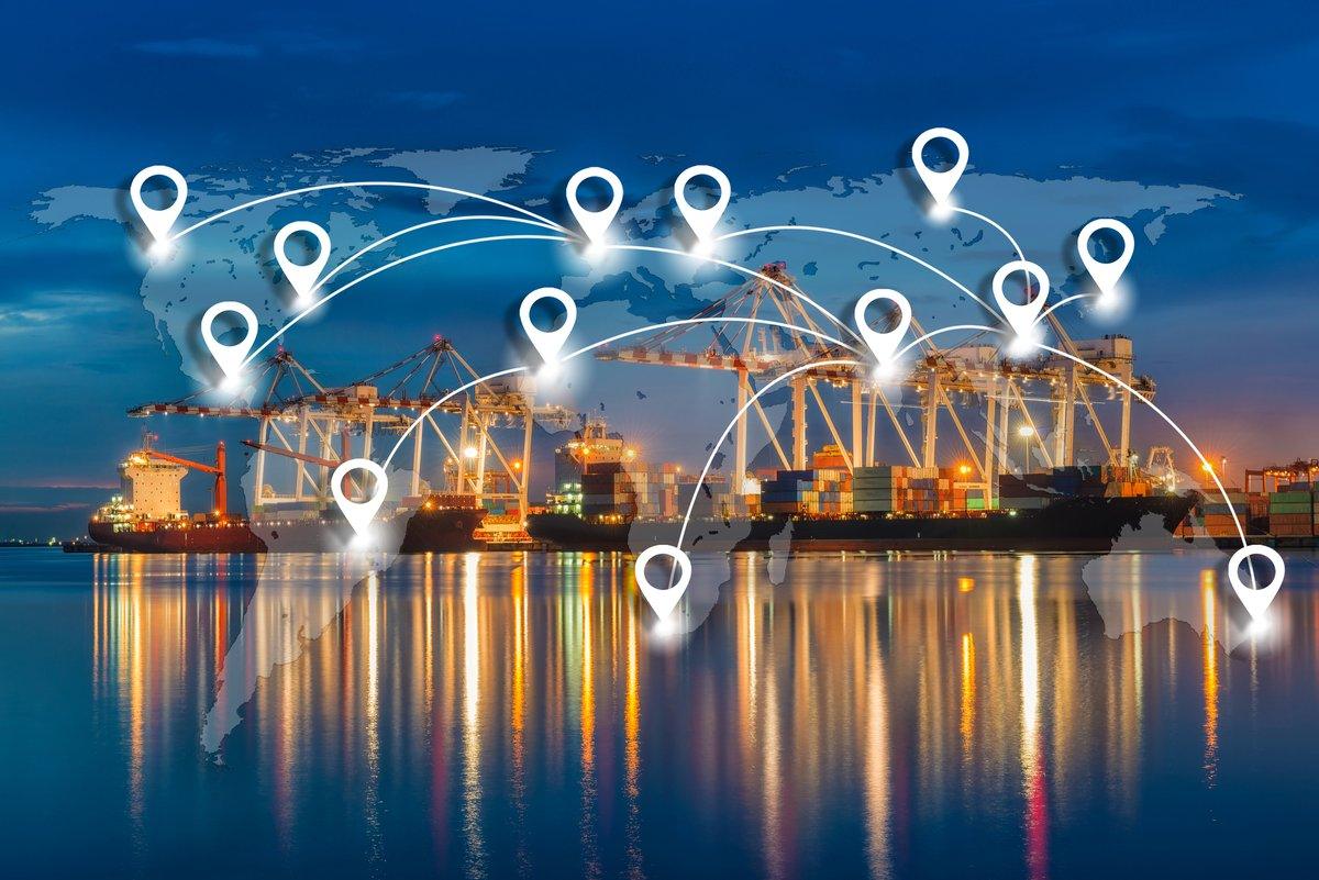 Port at night with location pins across a world map
