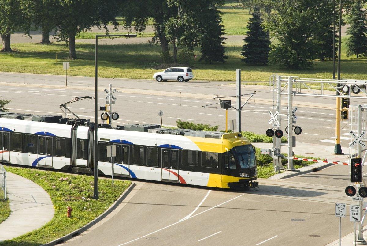 Light rail train at a street crossing